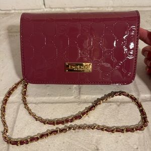 NWOT Dana embossed bebe crossbody patent purse in berry color